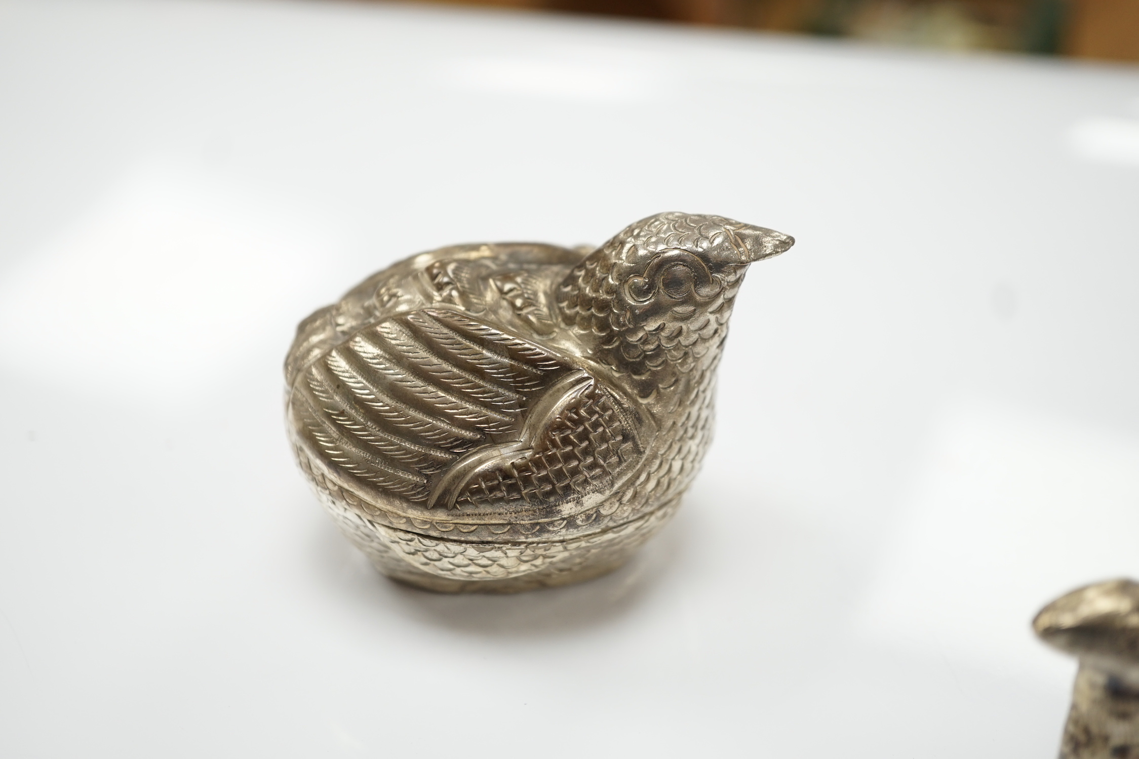 Four South East Asian white metal small ‘animal’ boxes. Largest 6cm